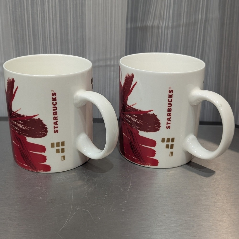 Starbucks 2014 Holiday Red‎ Gold Starburst Coffee Mugs Set of 2 12oz Ceramic